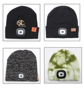 Detail shot of various knitted beanies featuring integrated LED lights and stylish textures