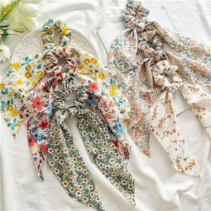 Detailed view of floral chiffon scrunchies with long ribbons in various spring patterns