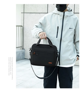 Black nylon business briefcase featuring adjustable shoulder straps and front zipper pocket