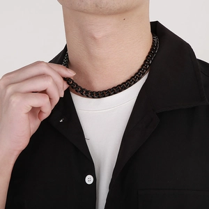 Men's black stainless steel Cuban link chain necklace shown on male model neck