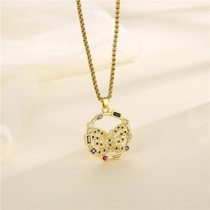 18K gold butterfly necklace with multicolor zircon stones on a soft beige fabric background