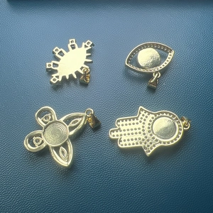 Golden Hamsa hand, evil eye, and butterfly shell pendants for DIY jewelry necklaces