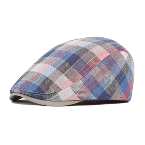 Detail of multi-color plaid cotton linen newsboy cap with breathable woven texture
