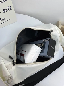 White large capacity sports travel bag with black straps and zipper for fitness and gym