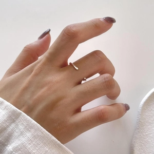 Minimalist 925 sterling silver irregular streamline open ring worn on a finger