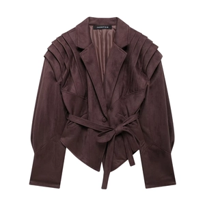 Detailed flat lay of dark brown suede motorcycle jacket with waist belt and pleated sleeves