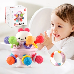 Colorful silicone baby teether ball with suction cup base and pink face for infant play