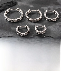 Close-up of five-piece silver titanium steel earrings with Cuban chain link design