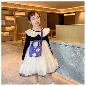 Detail of purple Halloween themed kids crossbody bag with ghost and pumpkin patterns