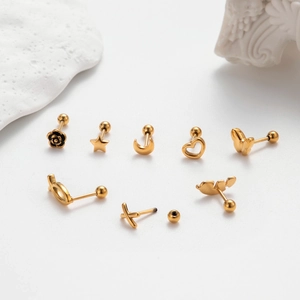 Gold stainless steel stud earring set with star, flower, and heart shapes on white background