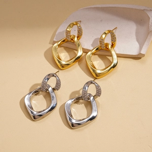 Geometric twisted silver earrings with zircons in gold and silver finish for women