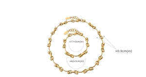 Detail of chunky gold chain jewelry set showing necklace and bracelet size measurements