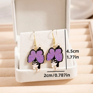 Macro view of purple cartoon cat butterfly earrings with size dimensions 4.5cm by 2cm