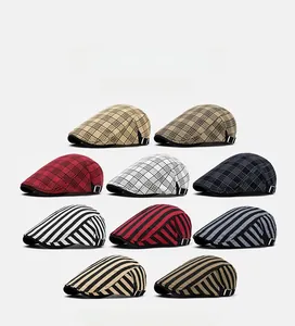 Detailed grid of assorted cotton plaid newsboy caps with adjustable side buckles