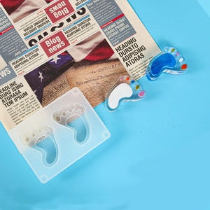 DIY baby footprint silicone mold for resin casting with blue and white finished pendants