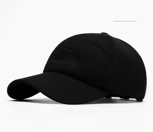 Detail of CREAT SHOW embroidery on black cotton baseball cap with curved brim and texture