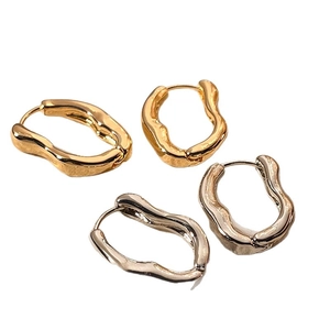 Minimalist irregular lava style hoop earrings in polished gold and silver finishes
