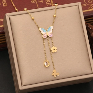 Golden butterfly necklace set with pink blue enamel wings and sparkling tassel pendants