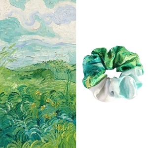 Detail showing high-quality satin scrunchie with French oil painting pattern inspiration