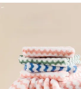 Detail of coral fleece kitchen towels showing absorbent wavy microfiber textures