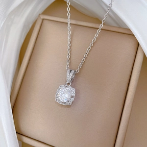 Titanium steel silver necklace with brilliant square halo zircon pendant on silk background