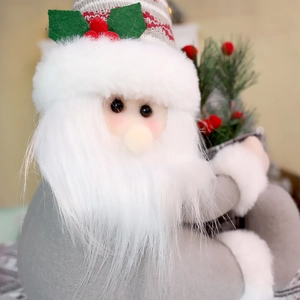 Close-up of plush Santa Claus figure with gray felt hat, white beard and berry accents