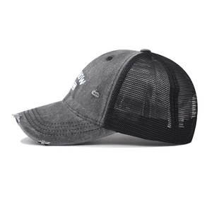Detailed side view of vintage distressed trucker hat with breathable mesh and HOW print