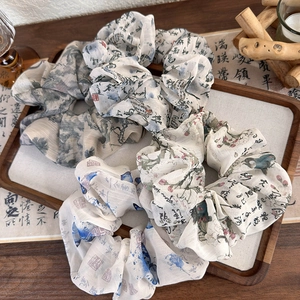 Retro ink wash calligraphy butterfly hair scrunchies displayed on a wooden tray