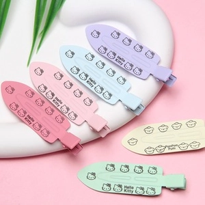 Detail of 5-piece gradient candy color hair clips with cute cartoon characters and text
