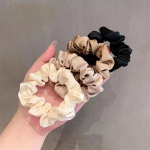 Set of four elegant satin scrunchies in black, coffee, champagne, and cream white