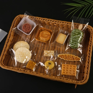 Food grade clear glossy packaging bags for mooncakes and snacks in a rattan basket