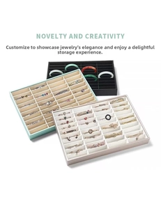 Three multi-slot jewelry display trays in black, mint green, and beige leather