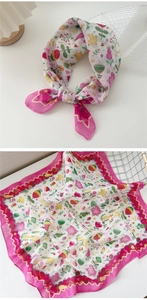 Detailed view of square cotton linen scarf with floral heart prints and pink wavy borders