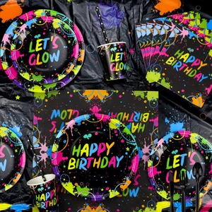 Close-up of neon glow party supplies set with Let's Glow themed plates and cutlery
