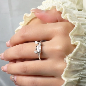 Detail of silver crab ring with marquise zircon and micro-pave crystals on the hand