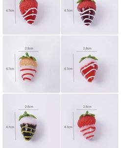 Detail of artificial resin strawberries with glaze drip decor in six vibrant colors