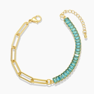 Gold paperclip chain bracelet with rectangular blue zircon crystals and adjustable clasp