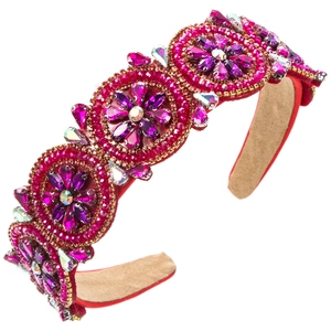 Detail of luxury wide headband with handmade fuchsia sequins and purple rhinestones