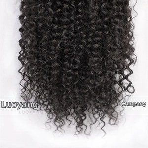 Detailed close-up of natural black kinky curly synthetic ponytail hair texture