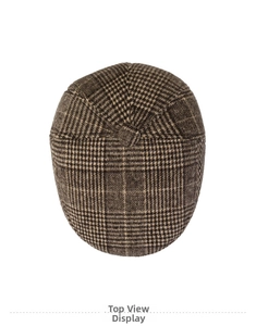 Overhead view of vintage houndstooth flat cap in brown wool blend for autumn winter
