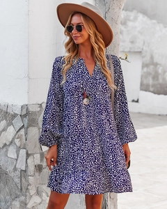 Detail of navy blue V-neck long sleeve leopard print dress with stylish wide brim hat