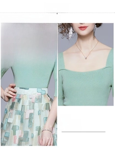 Detail view of square neckline knit top and elastic waist embroidered skirt set