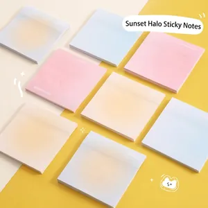 Macro shot of semi-transparent square sticky notes in a warm sunset glow pastel color palette