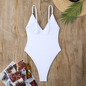 Back view of a white one-piece swimsuit with adjustable spaghetti straps and high-cut leg
