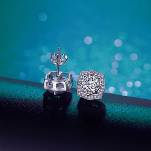 Macro shot of 925 sterling silver moissanite stud earring with flower halo and clear gem