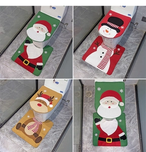 Detail view of 2-piece Christmas toilet seat cover and floor mat set with plush embroidery