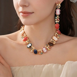 Vintage gold cameo jewelry set with colorful rhinestones and flower portrait design