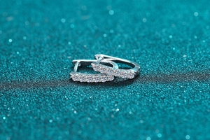 Detailed macro shot of 925 silver hoop earrings with shimmering moissanite pave setting