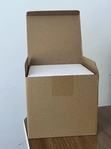 Protective cardboard packaging with foam inserts for the 3D cow ceramic coffee mug