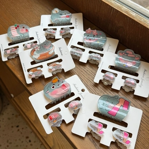 Detailed set of cute acrylic hippo hair clips featuring various funny cartoon characters